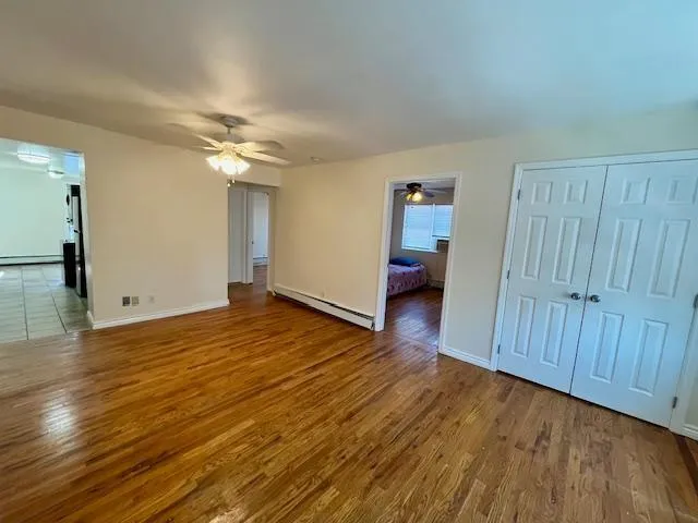 a view of a livingroom with wooden floor