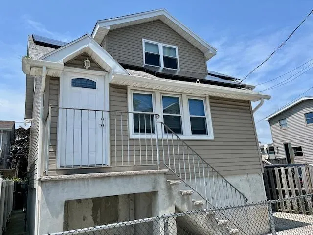 a front view of a house with a balcony