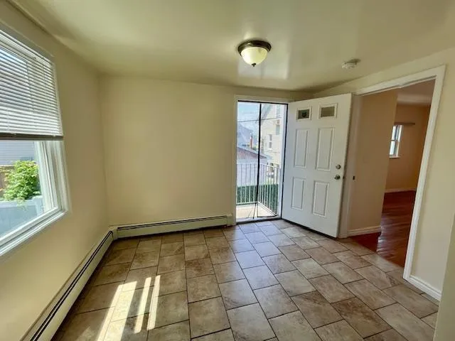 a view of empty room with windows