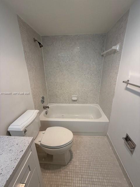20381 Northeast 30th Avenue, Unit 2047 Aventura, FL 33180 - Photo 11 of 21 a bathroom with a granite countertop toilet a sink and bathtub