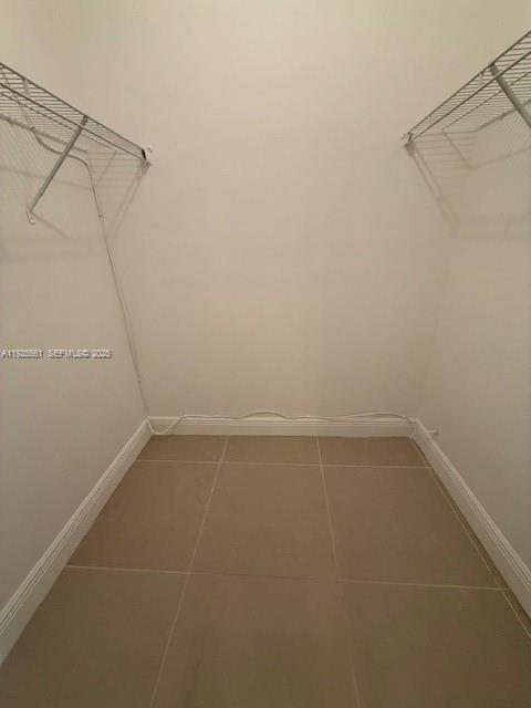 20381 Northeast 30th Avenue, Unit 2047 Aventura, FL 33180 - Photo 14 of 21 a view of a room with racks on the wall