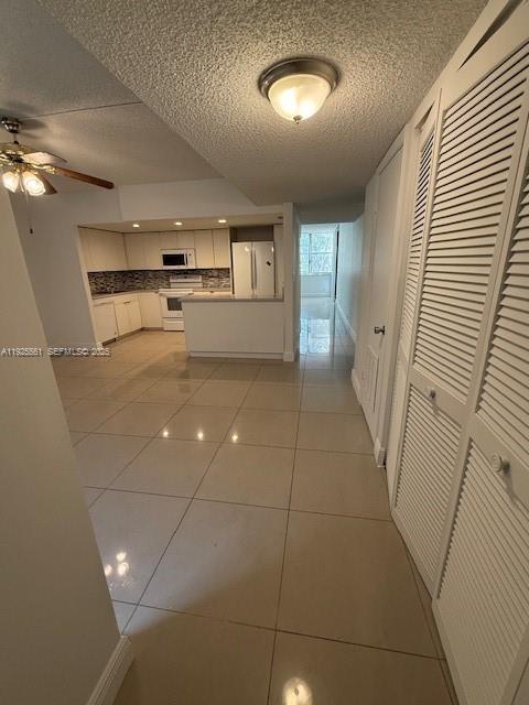 20381 Northeast 30th Avenue, Unit 2047 Aventura, FL 33180 - Photo 21 of 21 a view of a hallway to rooms and wooden floor