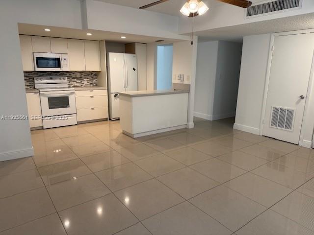 20381 Northeast 30th Avenue, Unit 2047 Aventura, FL 33180 - Photo 6 of 21 a kitchen with stainless steel appliances granite countertop a stove a sink and a refrigerator