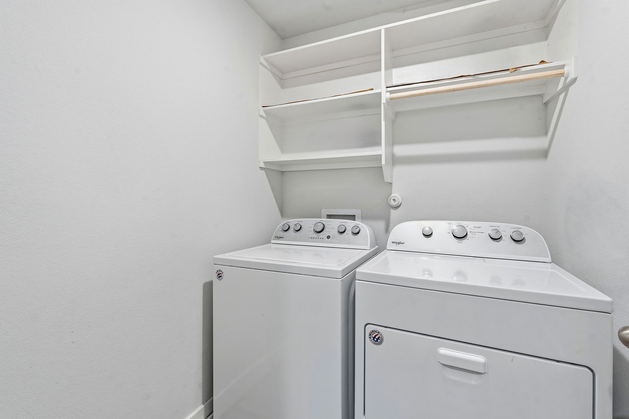 7105 Silver Star Lane, Unit 59 Austin, TX 78744 - Photo 16 of 19 a view of storage and utility room with washer and dryer