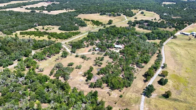 an aerial view of residential house with outdoor space