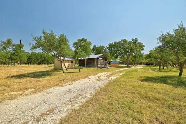 a house with swimming pool in front of it