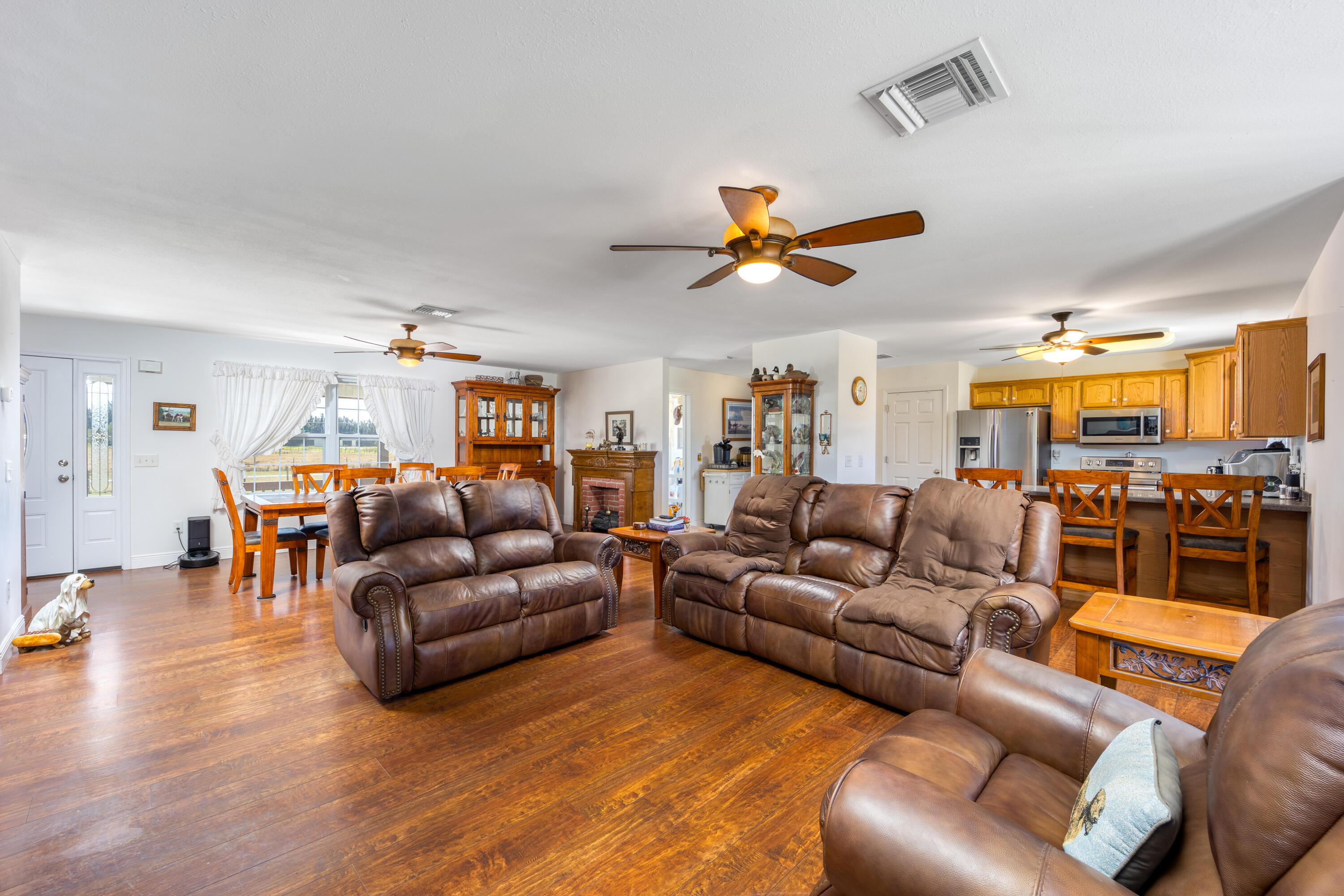 1101 Trowbridge Road Fort Pierce, FL 34945 - Photo 27 of 38 a living room with furniture kitchen view and a large window