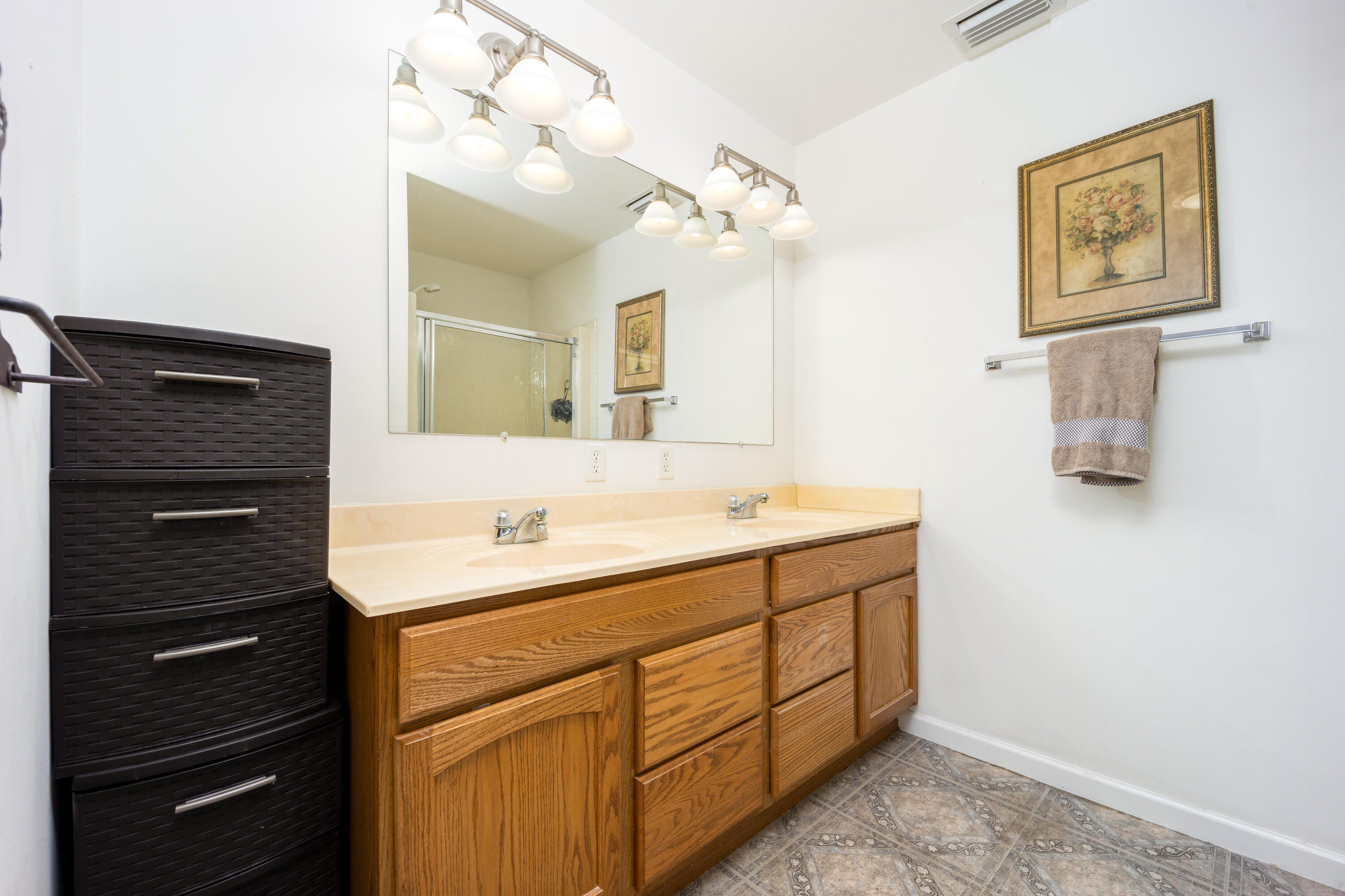 1101 Trowbridge Road Fort Pierce, FL 34945 - Photo 32 of 38 a bathroom with a sink vanity and mirror