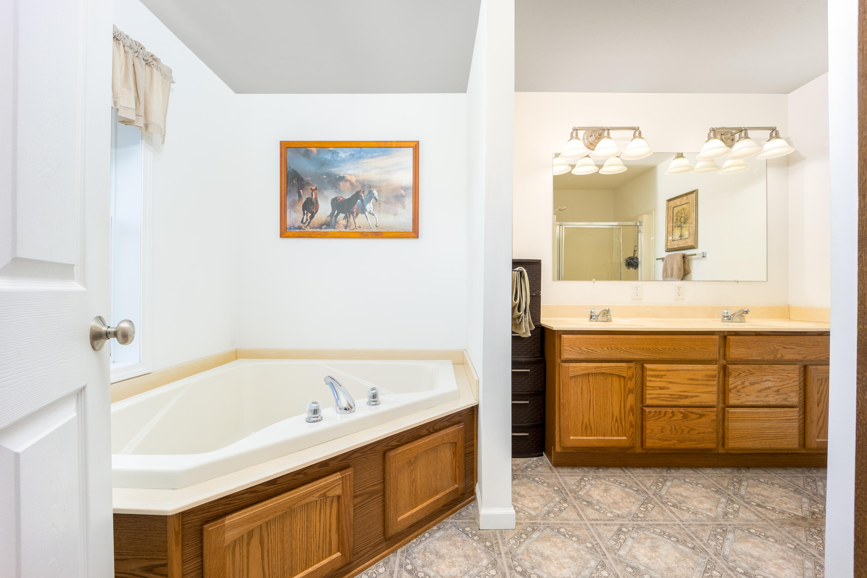 1101 Trowbridge Road Fort Pierce, FL 34945 - Photo 8 of 38 a bathroom with a tub sink and mirror