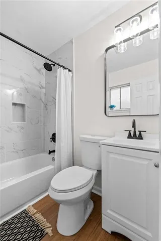 a bathroom with a sink a toilet and a bathtub