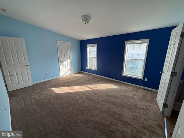 a view of empty room with windows