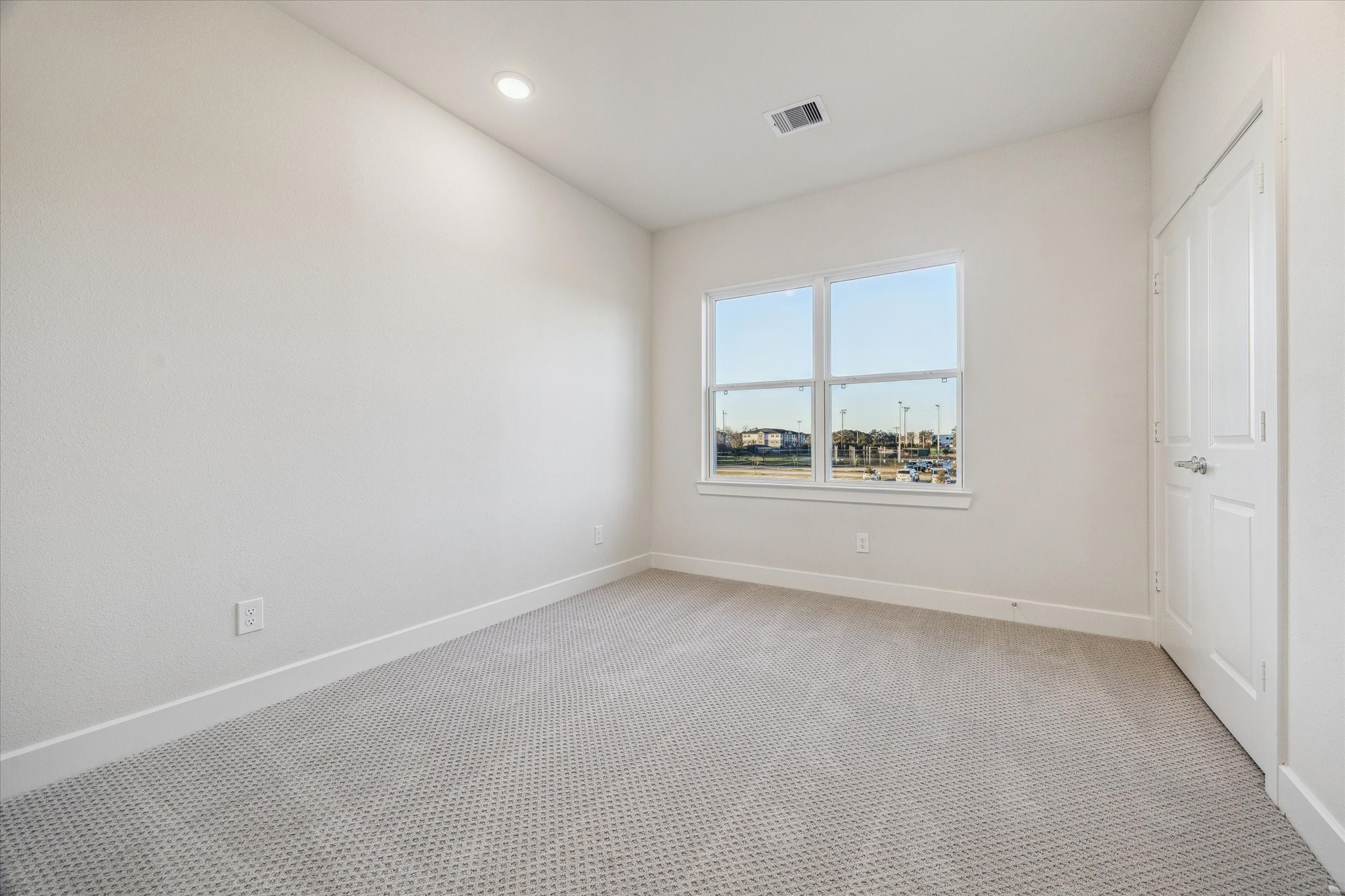 6547 Rena Street Houston, TX 77092 - Photo 9 of 10 Secondary Bedroom – Previous work by the builder in the community, not representation of exact unit listed.