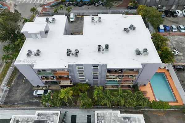 an aerial view of residential houses with outdoor space