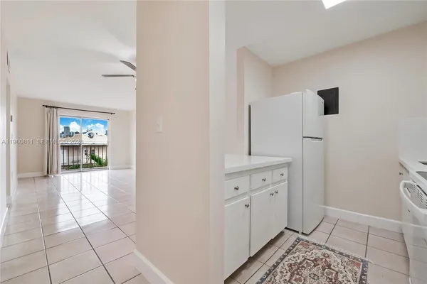 a kitchen with a sink and a stove top oven