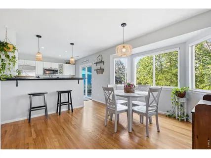a dining room with furniture window wooden floor