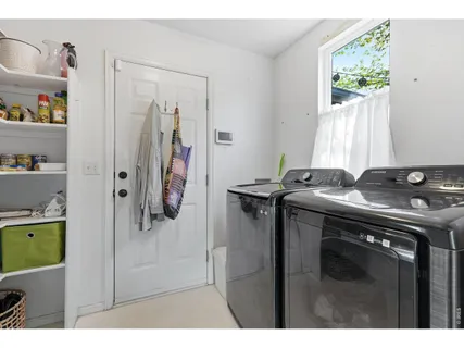 a utility room with closet dryer and washer