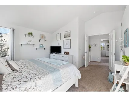 a large white bed in a white room