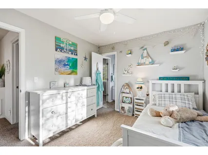 a bedroom with furniture and a wooden floor