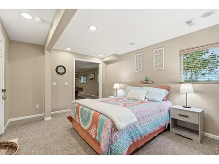 a bedroom with a bed and a couch