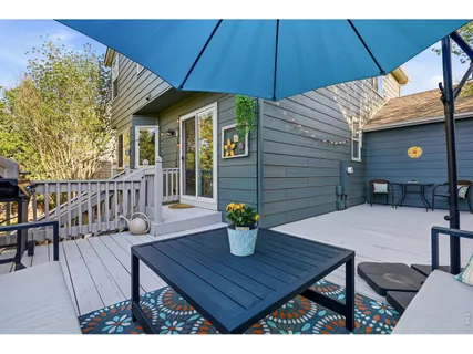 a view of outdoor dining space with a table and chairs