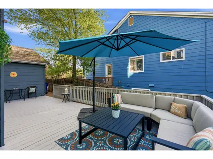 a terrace of a house with outdoor seating