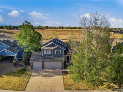 an aerial view of residential houses with outdoor space