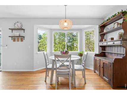 a view of a dining room with furniture window and outside view