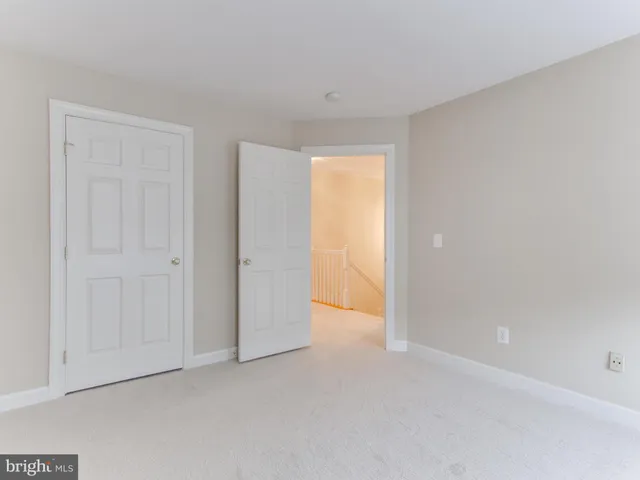 a view of an empty room and a window