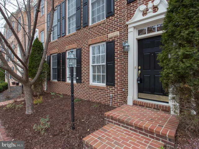 a brick house with a large windows