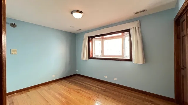 a bathroom with a granite countertop toilet sink shower and mirror