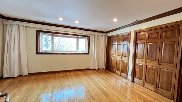 a view of a house with a door and wooden floor