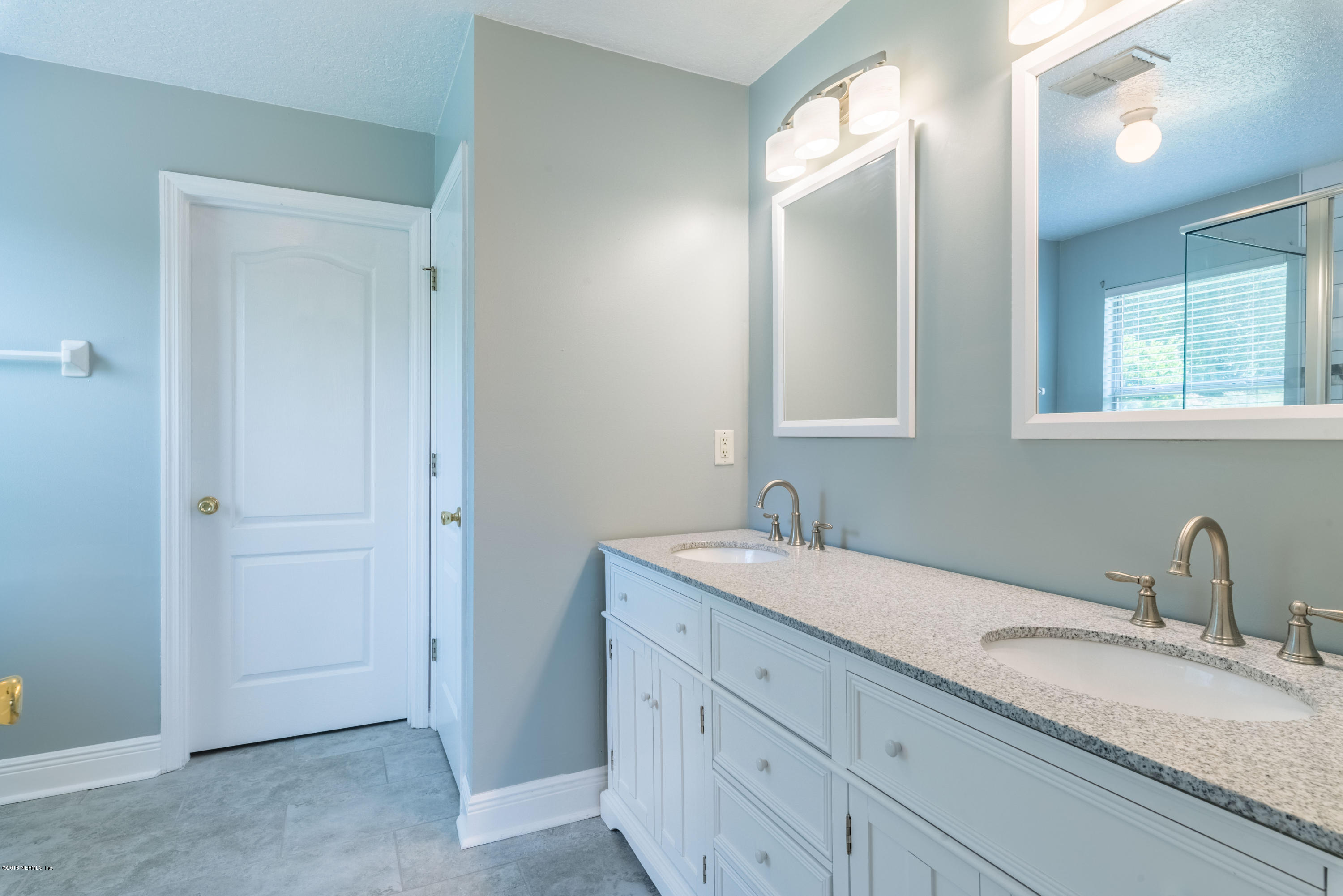 10368 Sugar Grove Road Jacksonville, FL 32221 - Photo 15 of 28 a bathroom with a sink and a mirror