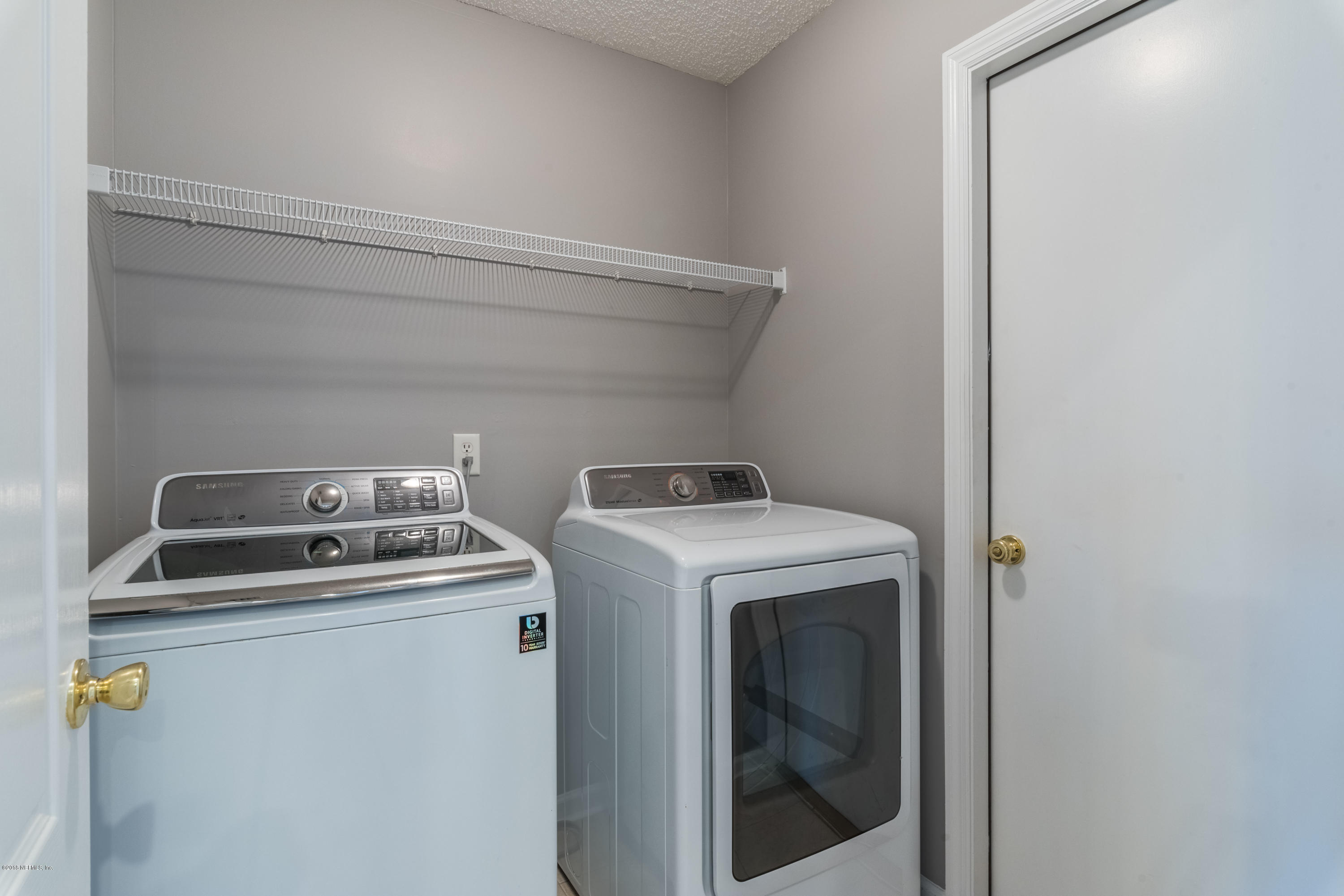 10368 Sugar Grove Road Jacksonville, FL 32221 - Photo 20 of 28 a utility room with dryer and washer