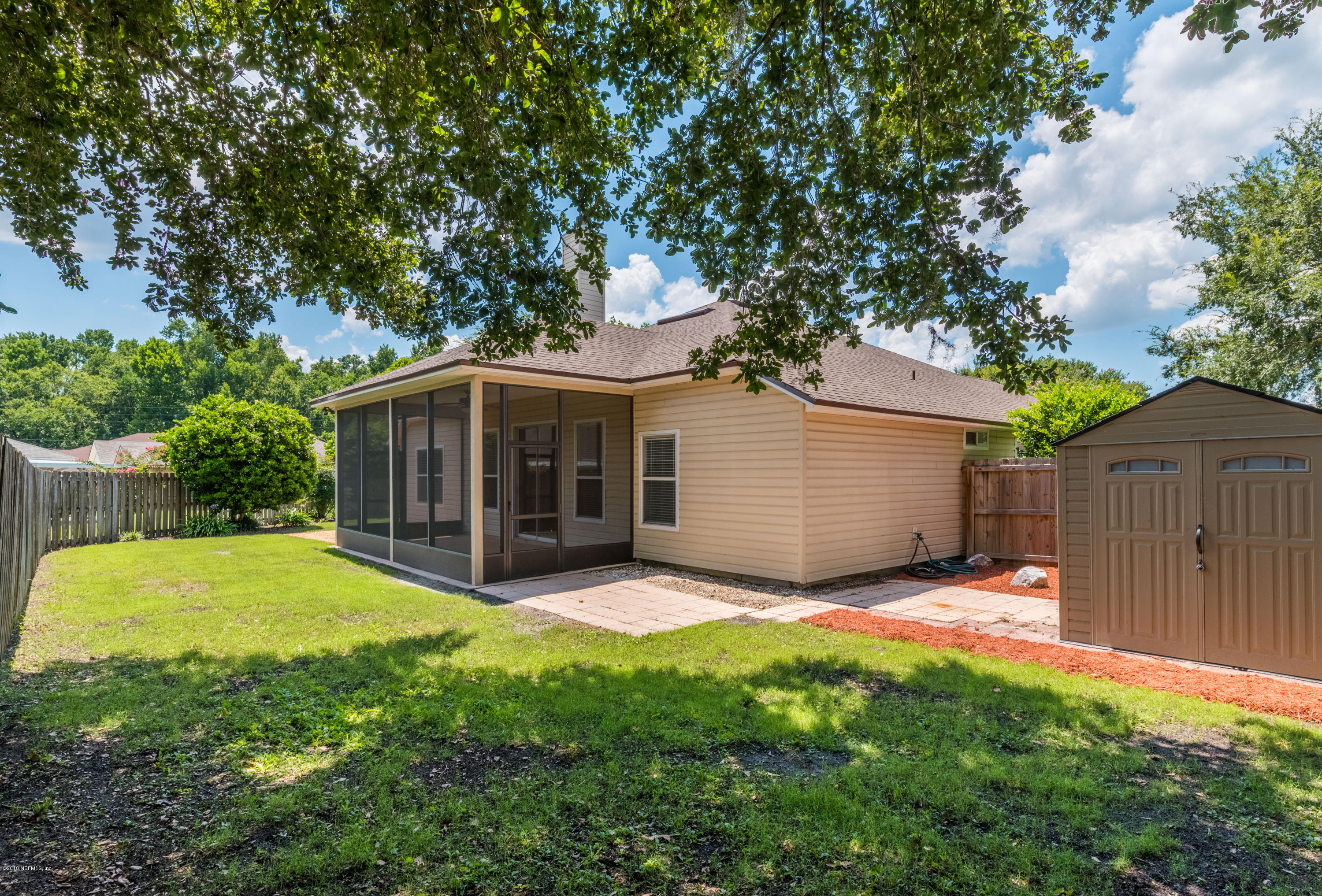 10368 Sugar Grove Road Jacksonville, FL 32221 - Photo 24 of 28 a view of a house with a yard and large tree