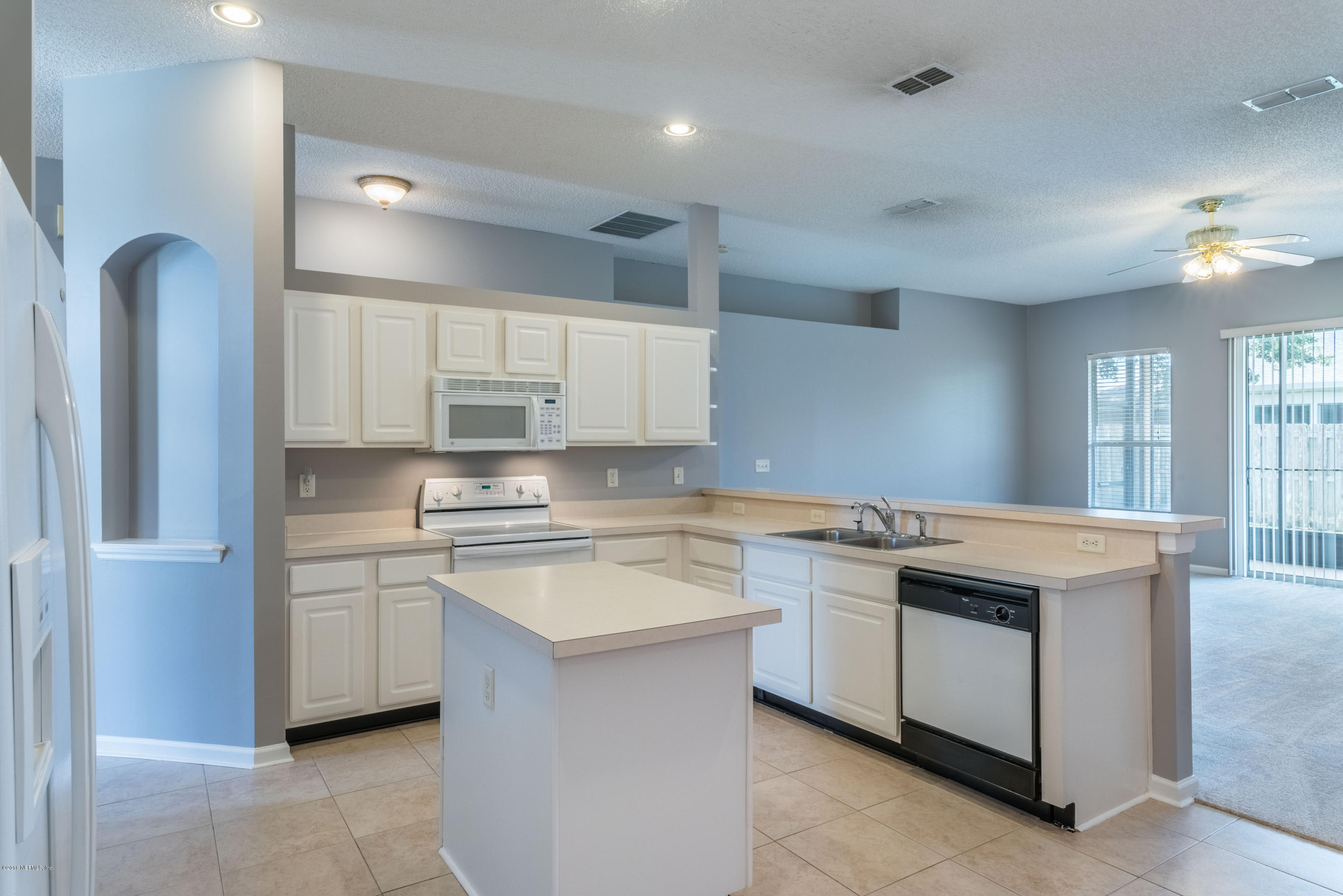 10368 Sugar Grove Road Jacksonville, FL 32221 - Photo 7 of 28 a kitchen with a sink stove and cabinets