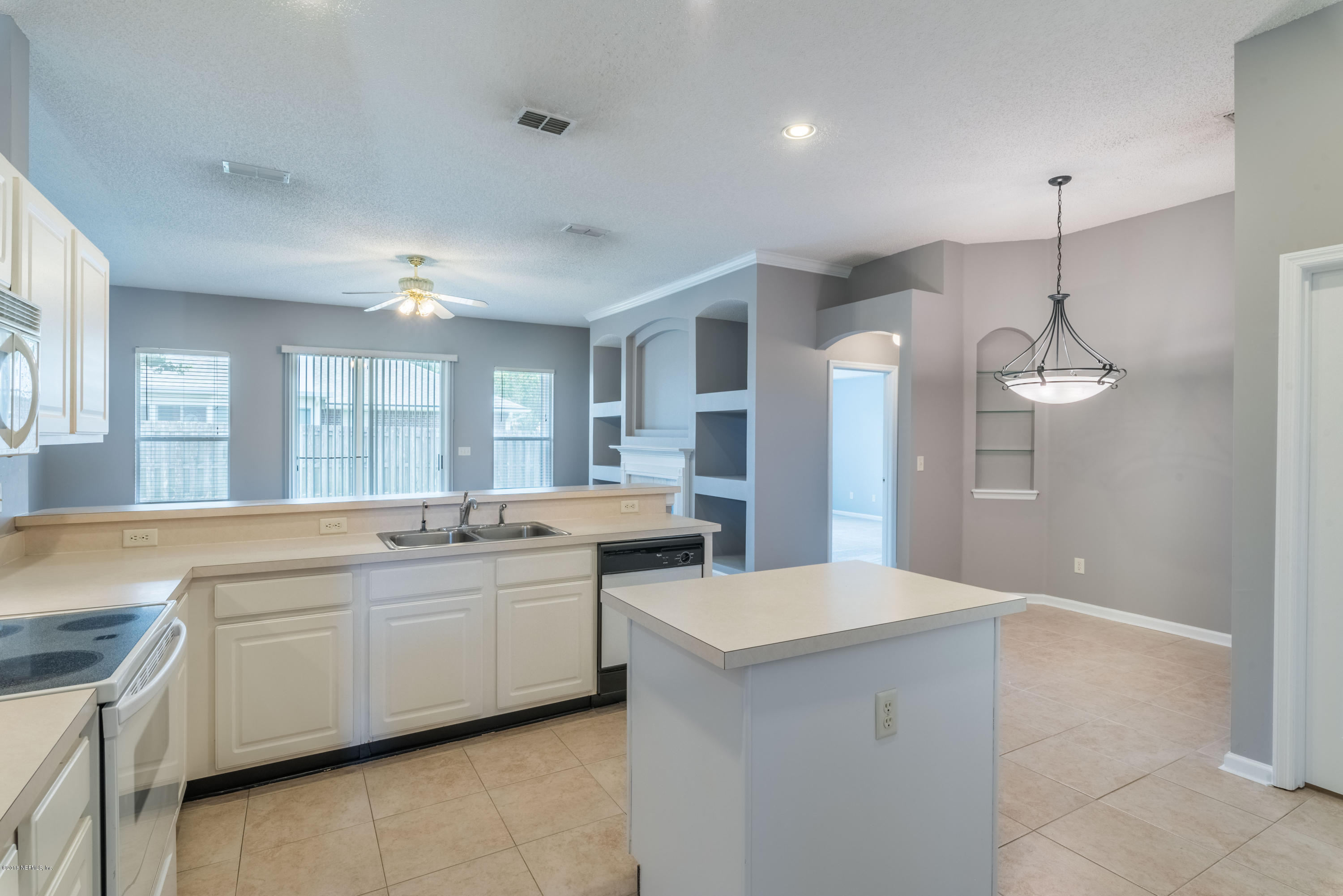 10368 Sugar Grove Road Jacksonville, FL 32221 - Photo 8 of 28 a large kitchen with a lot of counter space and a sink