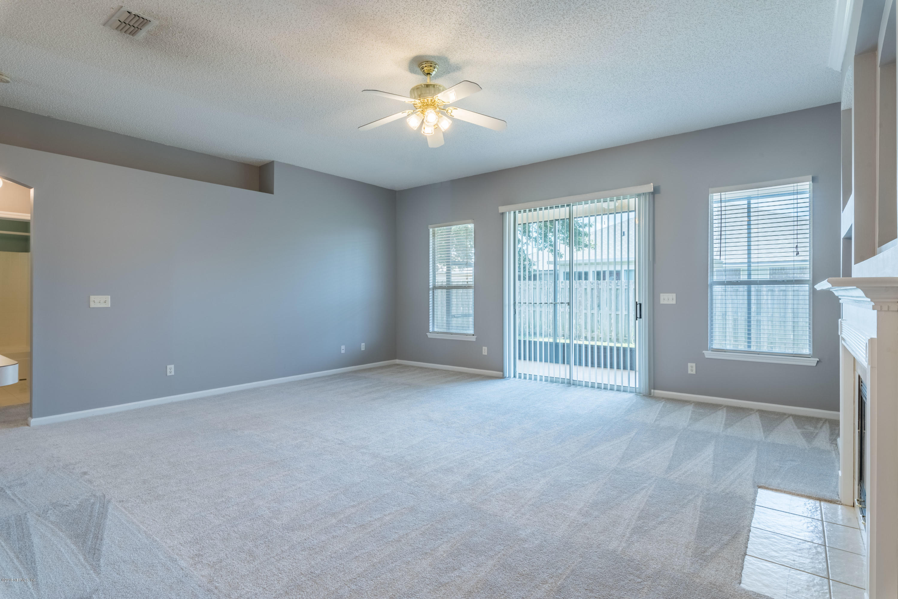 10368 Sugar Grove Road Jacksonville, FL 32221 - Photo 10 of 28 a view of an empty room with a window