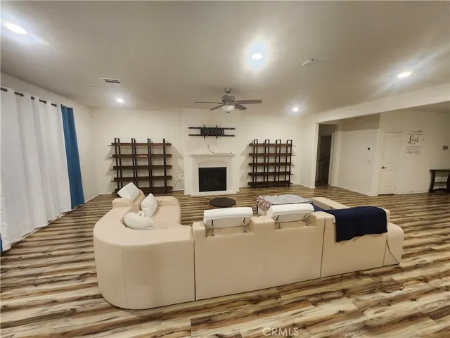 a bedroom with two beds and a couch