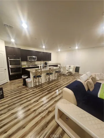 a bed room with a bed and a chandelier