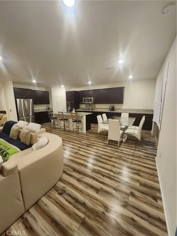 a bedroom with a bed and a television