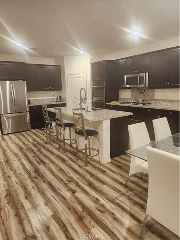 a bathroom with a sink toilet and mirror