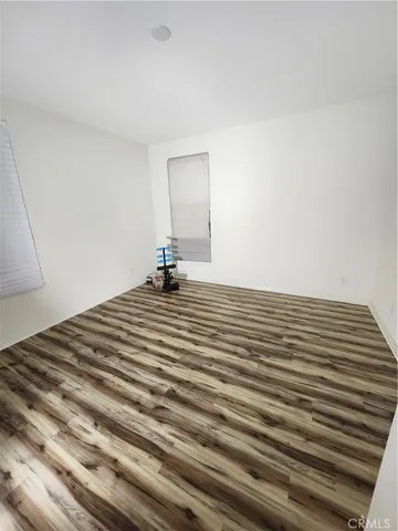 a bedroom with a bed and a mirror