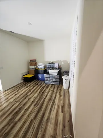 a workspace with furniture and wooden floor