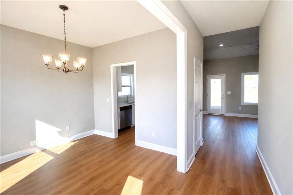 23 S Road Griffin, GA 30224 - Photo 4 of 32 a view of a livingroom with wooden floor and a large window