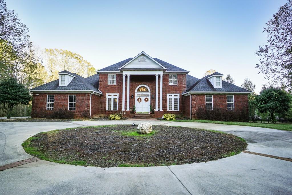 3071 Holly Springs Road Rockmart, GA 30153 - Photo 1 of 1 a front view of a house with garden