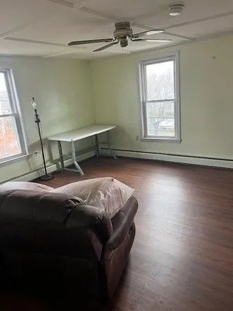 a bedroom with bed and window