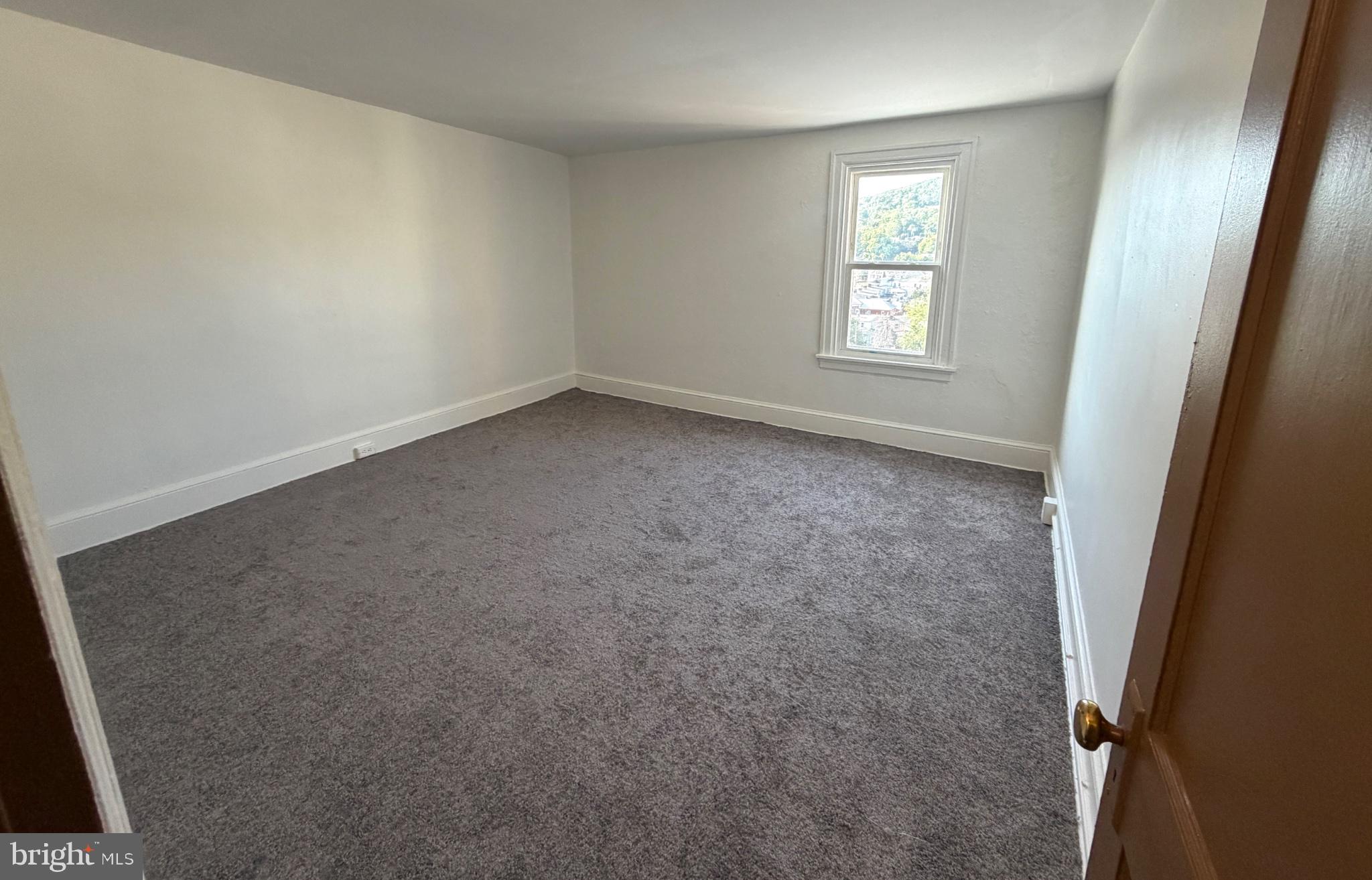 1519 Fairview Street Reading, PA 19606 - Photo 9 of 12 Spacious, sunlit room with potential.