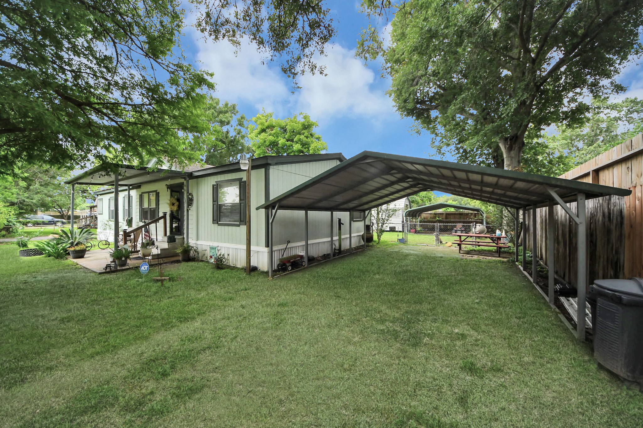 204 Edith Street Highlands, TX 77562 - Photo 29 of 33 a view of backyard with deck and outdoor seating