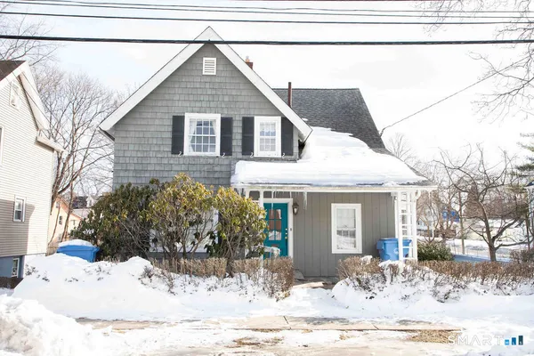 a view of a house covered in snow