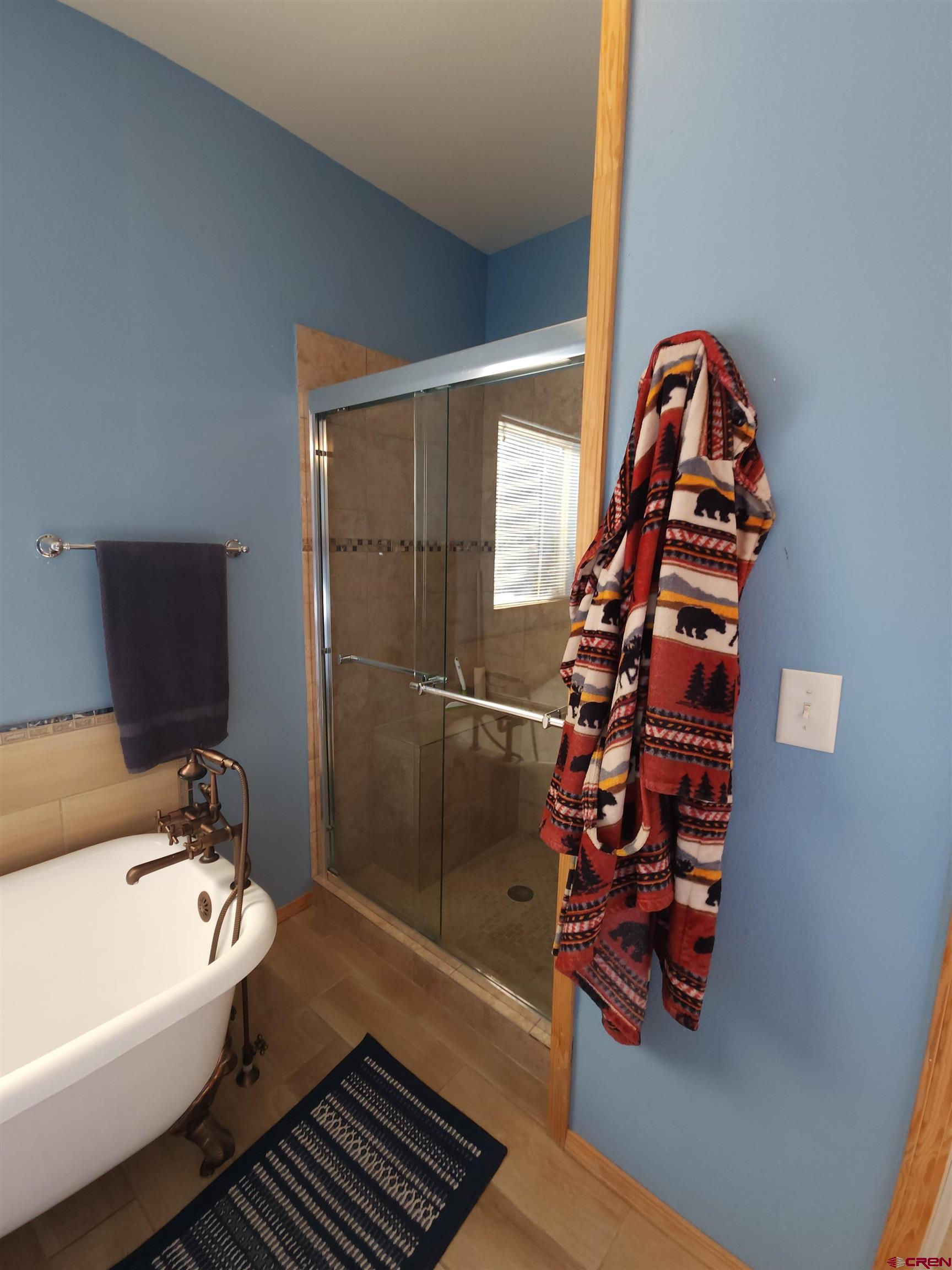 323 Holiday Overlook Crestone, CO 81131 - Photo 5 of 30 a bathroom with a bathtub and a shower